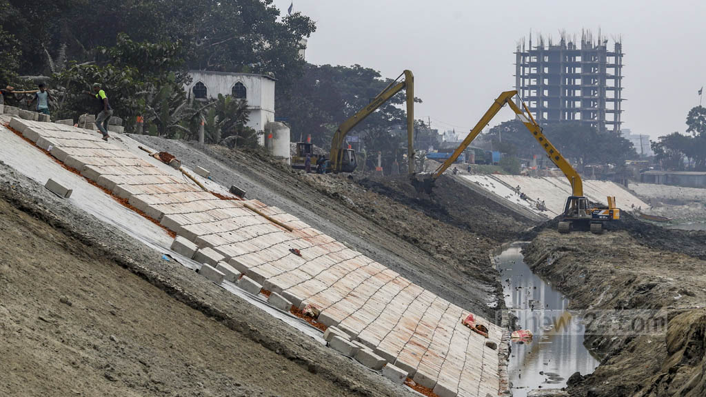 Barriers, walkways under construction along Turag River