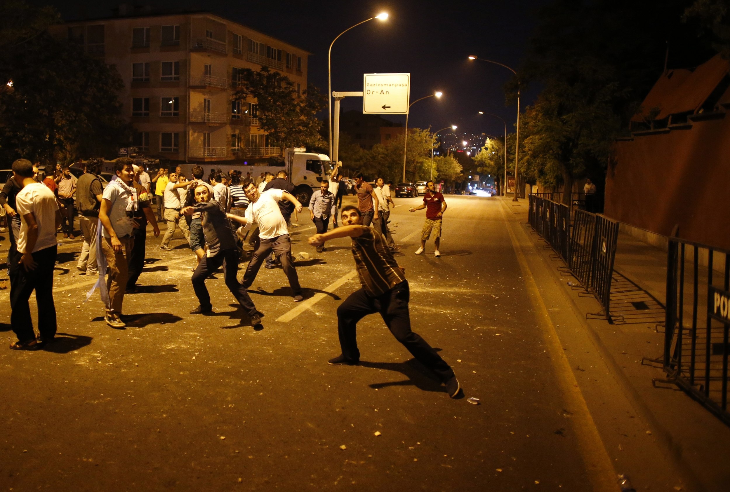 Demonstrators throw stones at the Israeli Embassy in Ankara, as they protest against Israel's military action in Gaza, July 18, 2014. 