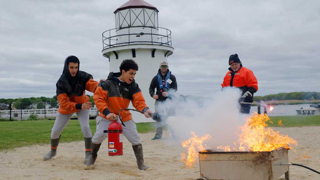 Brothers Tom and David O’Brien, who work as commercial fishermen on a lobster boat, practice extinguishing a fire during the Fishing Partnership Support Services’ safety training course, which may end as early as this spring due to sweeping government job and funding cuts at the National Institute for Occupational Safety and Health, in Newburyport, Massachusetts, US, May 20, 2025. REUTERS