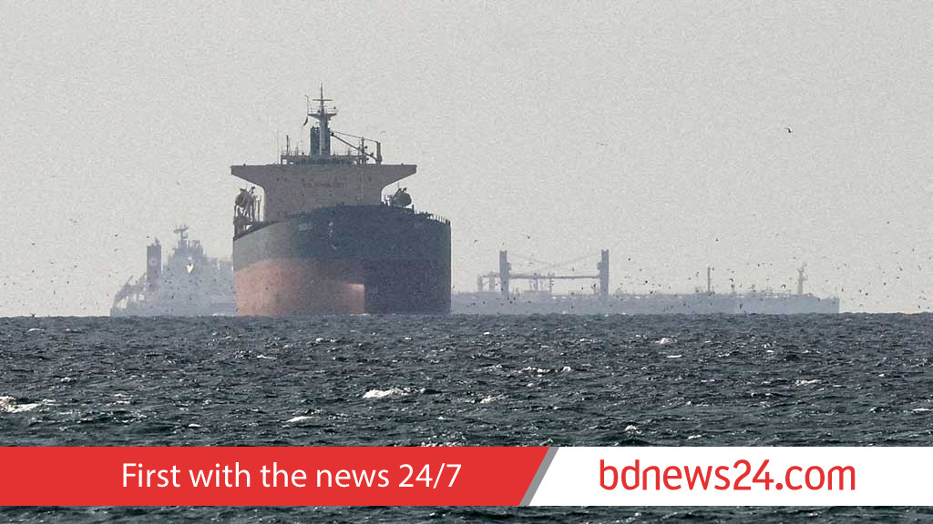 Iran says Hormuz shut, vessels report gunfire