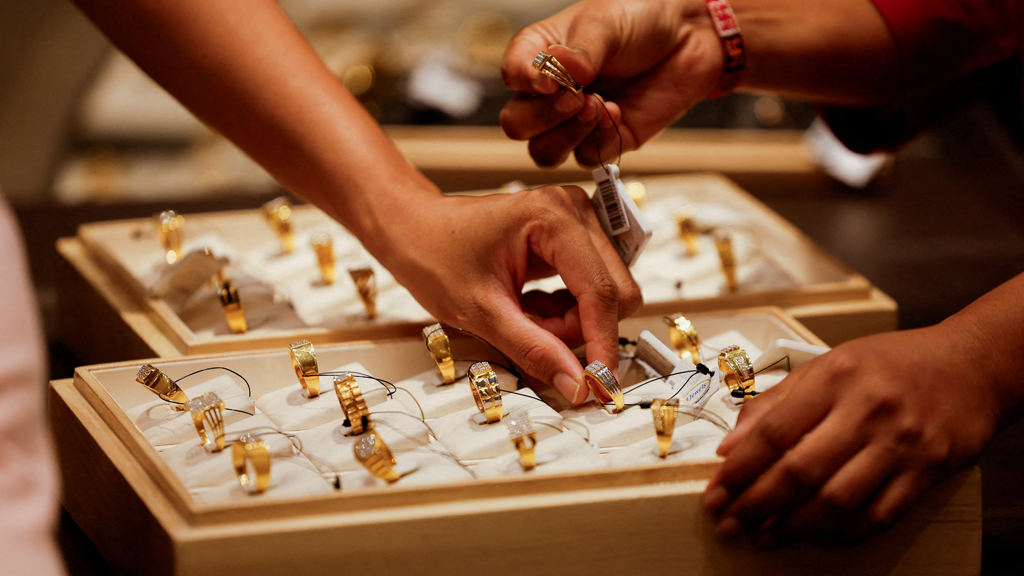 Gold dips, stocks lift as Trump walks back Greenland threats